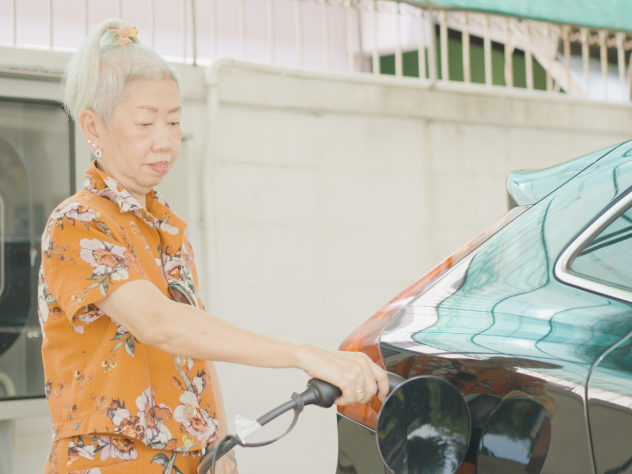 Person using home battery to charge their electric vehicle.