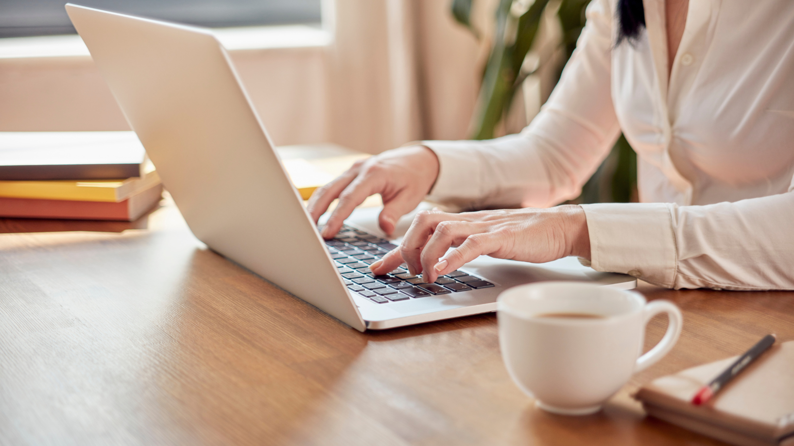 Woman typing on a laptop
