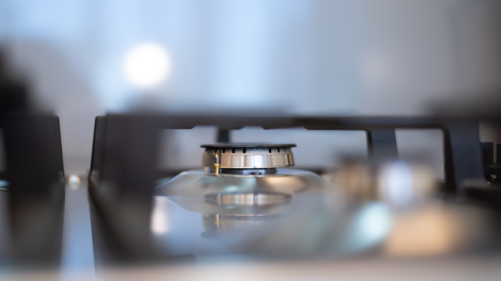 Photo of a lone gas stovetop burner turned off