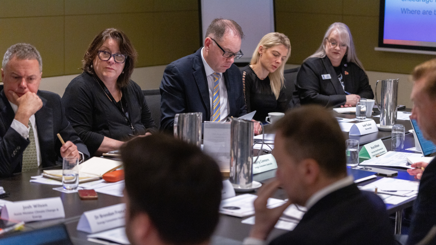 Photo of a group of people at a boardroom table