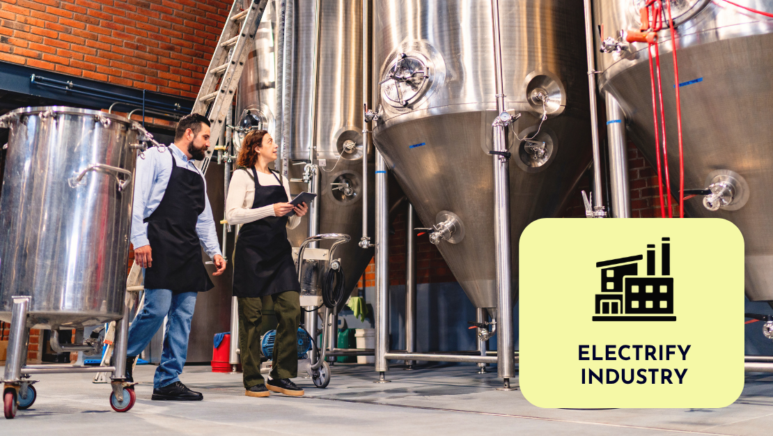 Photo of two people in industrial setting with text: Electrify Industry