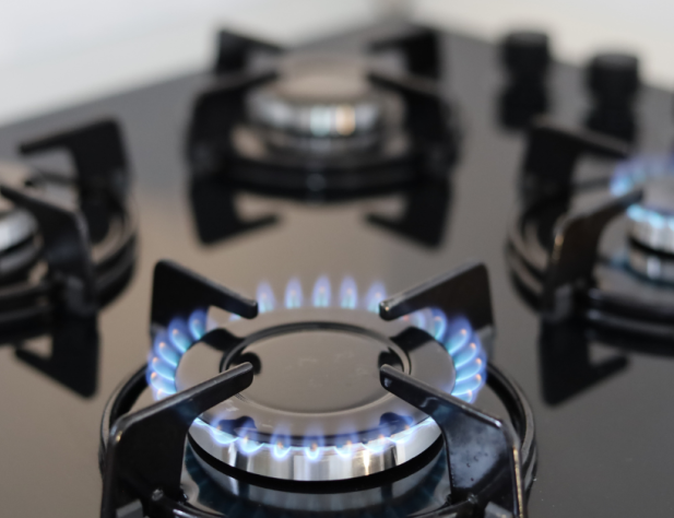 Close-up photo of gas cooktop alight