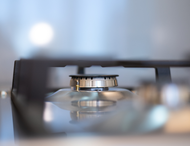 Photo of a lone gas stovetop burner turned off