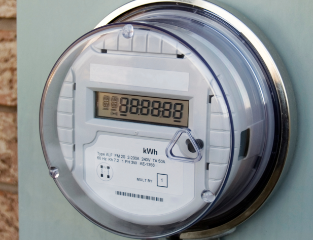 Close-up photo of a smart meter on an exterior brick wall