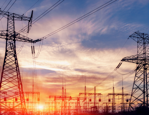Photo of transmission lines at sunset
