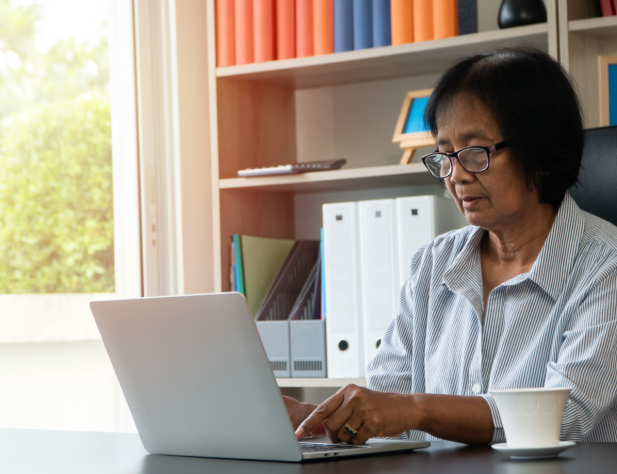 Woman looking at laptop